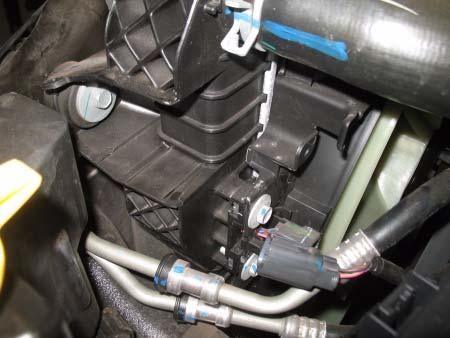 Remove four bolts from AC condenser and intercooler. Support AC condenser.