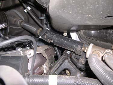 Remove brake sensor wire harness from passenger and driver fender wells. Driver Side DO NOT perform the following procedure until the engine is completely cool.