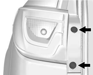 Vehicle Care 10-27 To replace one of these bulbs: 1. Open the liftgate. See Liftgate on page 2-8. 2. Remove the convenience net, if the vehicle has one. 3. Remove the two taillamp screw covers. 4.