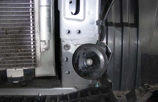 I). Loosen the 12mm (head) bolt on the horn bracket, and relocate it the