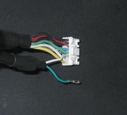 Pull lightly on the white wire to confirm the locking mechanism has latched. This figure shows the correct placement of the AEMnet+ terminal.