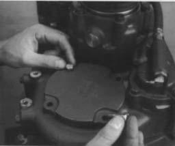 With the transmission set in the vertical position, block under the clutch housing to prevent damage to the input shaft, position the new gasket on the transmission case.