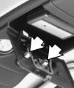 The pegs inside the compartment door are used to make sure the button on the compartment door will contact the control button on the garage door opener. 6.