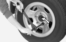 Then put your compact spare tire near the flat tire. 2.