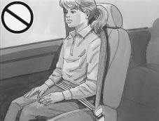 CAUTION: Never do this. Here a child is sitting in a seat that has a lap-shoulder belt, but the shoulder part is behind the child.