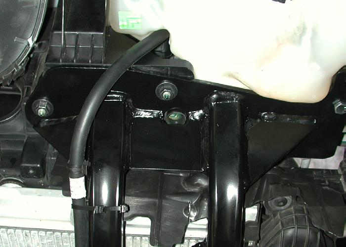 R only, remove one plastic fastener attaching the wiring harness to the back of the bumper core (Fig.Q). 14.
