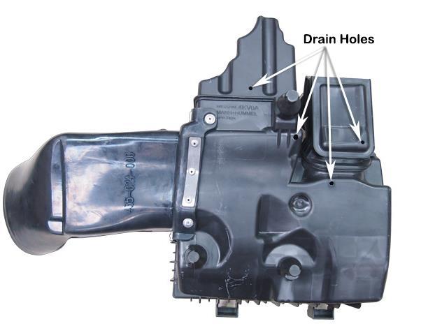 The drain holes can permit water to enter the air intake.