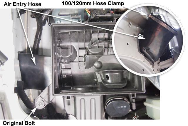 32 Install the air cleaner base and hose assembly into the vehicle.