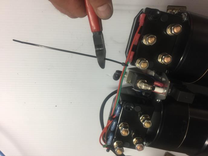 Fit the wiring to the solenoids as shown, and the earth connection to the rear motor