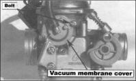 The bottom side of the vacuum membrane should be aligned with the carburetor, and the topside should be aligned with the vacuum membrane.