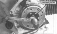 Remove the flywheel with a flywheel puller, and remove the solid key.