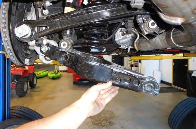 7. Remove the inner control arm bolt.