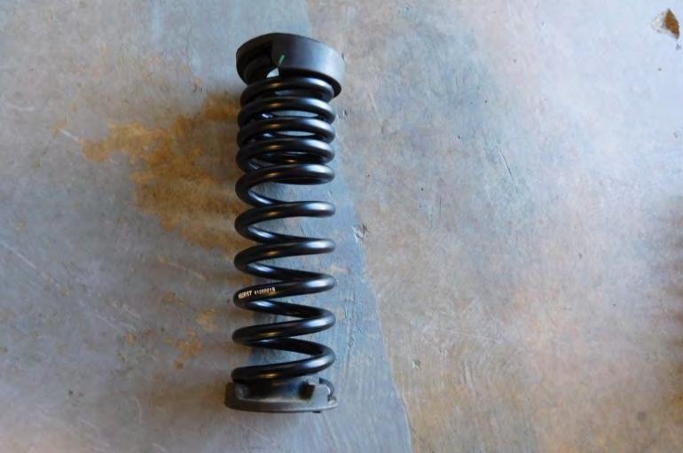 10. Remove the factory spring rubber from the top and bottom of the spring. 11.
