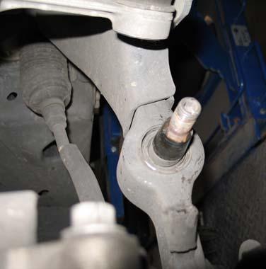 Using a wrench, remove all the mounting nuts that attaches the top of the spring/strut assembly to the chassis. 2c.