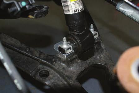 Support suspension and remove upper ball joint nut Lower