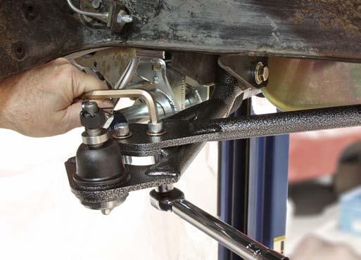 23. Once adjustment is complete, tighten the jam nut against the strut rod.