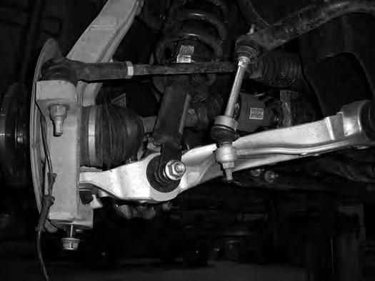Retain mounting bolt and upper ball joint nuts. 20. Continue to lower the jack allowing the knuckle/cv axle and lower control arm to swing down. Slide the CV axle off of the differential.