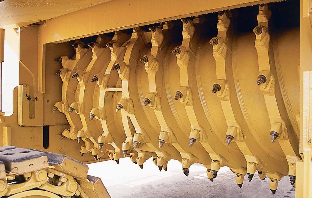 Large replaceable carbide-faced loading paddles effectively moves milled material onto collecting conveyor resulting in higher production and less wear on inside of rotor