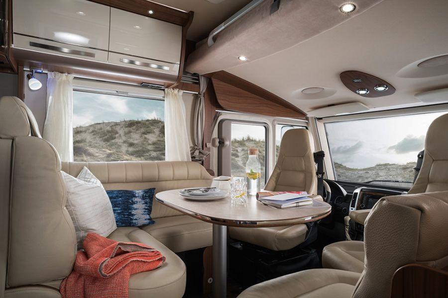 The comfy L-shaped seating area in the Hymermobil StarLine 680 is a pleasant place to