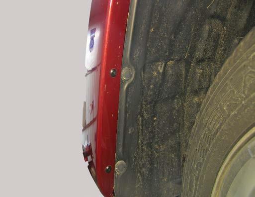 1. DODGE ONLY: Using a flat screwdriver, remove two pushpins just forward the front tire, on the wheel well.