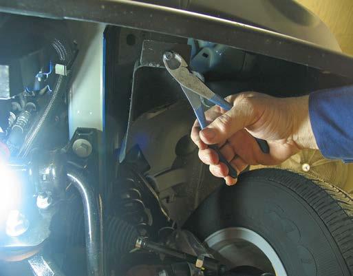 DODGE ONLY: Remove two pushpins with a flat screwdriver (see photo 11B) and a