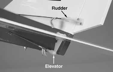 Insert the main landing gear wires into the holes in the landing gear blocks in the bottom of the fuselage. Secure the gear with two nylon straps and four 2.5 x 12mm screws.