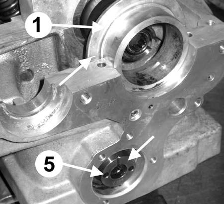 11.2) on the compensating link plate (fig.11.4). 3.3.9. Guide the link plate (fig.13.4) and the camshaft drive gear (fig.13.1) into the gear cavity from above.