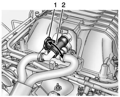 10-22 Vehicle Care { WARNING An electric engine cooling fan under the hood can start up even when the engine is not running and can cause injury.