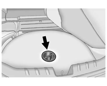 Vehicle Care 10-79 3. Turn the center retainer counterclockwise to remove the cover. 4. Remove the tire sealant and compressor kit from the foam container.