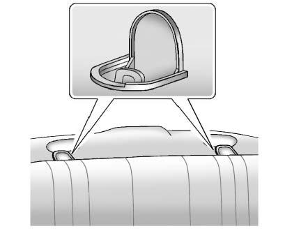 3-40 Seats and Restraints To assist in locating the lower anchors, each seating position with lower anchors has two labels, near the crease between the seatback and the seat cushion.