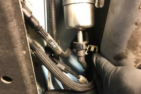 Make sure to allow enough room to access the hose end fitting that will be installed later. 18 7mm Socket Wrench Hose Cutter Loosen the worm drive hose clamp near the gas tank.