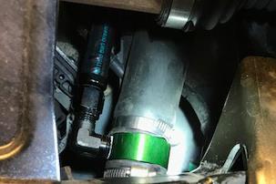 29 The highest point on the FST is used as the overflow port. It is important to route this hose to the Radium barbed coupler fitting that is attached to the OEM fuel filler hose.