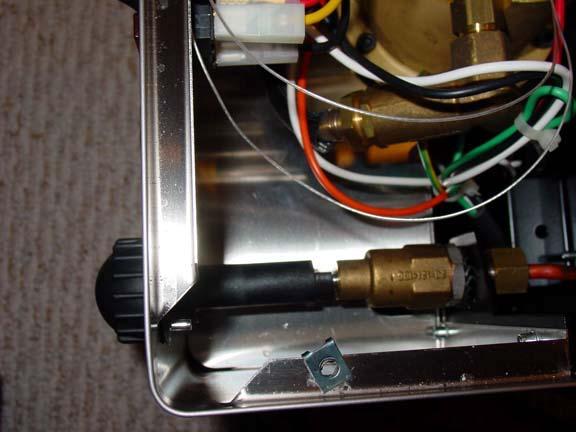 Fig 14. The steam valve control nub. 4) Remove the front panel.