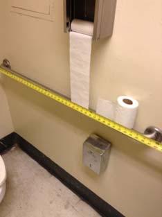 located over 9" from edge of toilet Relocate TPD with 9" maximum from edge of toilet Sidewall grab bar