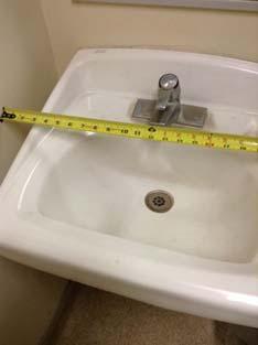 from edge of toilet Lavatory not 8" minimum to centerline from side wall or