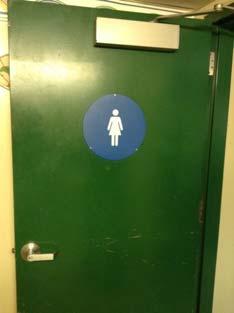 replace operable part Toilet door sign not contrasting colors Remove and replace sign