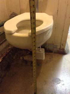 accessible toilet compartment Relocate/adjust as required Seat height measured over 9"