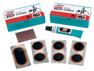 tube of CFC-free cement 2 Two-wheel repair kit TT 0, touring Each kit includes the following: 4 round tube patches oval tube patch emery paper tube of