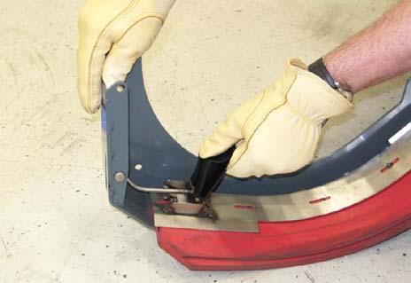 MAINTENANCE REPLACING OR ADJUSTING THE SIDE BRUSH SQUEEGEE BLADE (S/N 001279 - ) (OPTION) 4. Remove the squeegees, spacer, and retainer from the squeegee bumper.