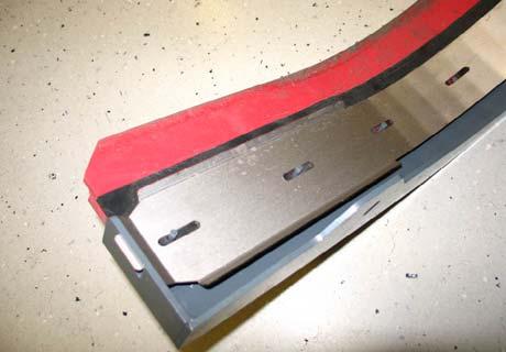 Replace the blade if the leading edge is torn or worn half-way through the thickness of the blade. 1. Lower the scrub head. 2. Pull the pins and remove the squeegee bumper.