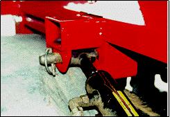 Refer to Figure 24. Figure 26: Installing lift cylinder arms Note: When installing the four pivot pins, ensure that the locking pins are installed and completely latched.