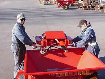 Figure 2: Removing shipping bracket 4. This step requires two people. Lift the Twin Spinner out of the hopper using the outer grab handles of the Twin Spinner.