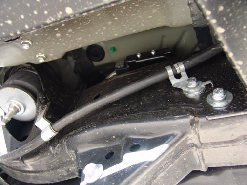 brackets are located. Install the gas tank skid plate (photo 10B) with supplied hardware.