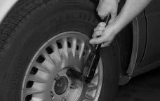 If your vehicle has a steel wheel with a wheel cover, the center hub cap must be removed first by using the flat end of the wheel wrench to pry it off.