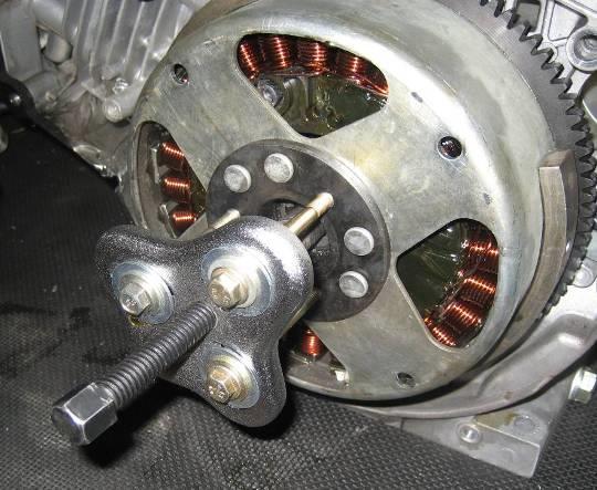 5.9.2 Stator Removal and Reassembly Drain all gasoline from the fuel tank before disassembly. Keep the unit away from all heat, flame and sparks. 1. Follow steps 1-7 in (section 6.