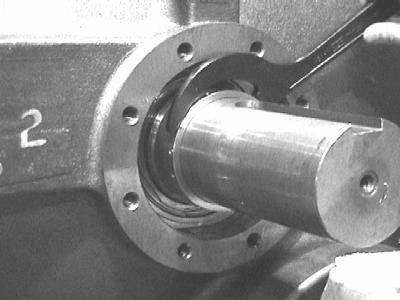 the pin groove on the stationary side seal assembly with the pin on the oil flushing ring adapter. 3. Mount the threaded ring jig on the rotary side seal ring assembly.