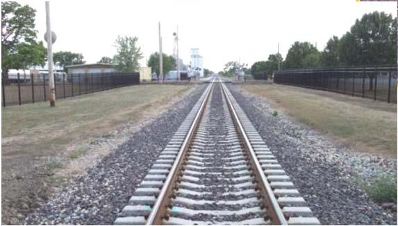 requires fencing at grade crossings with
