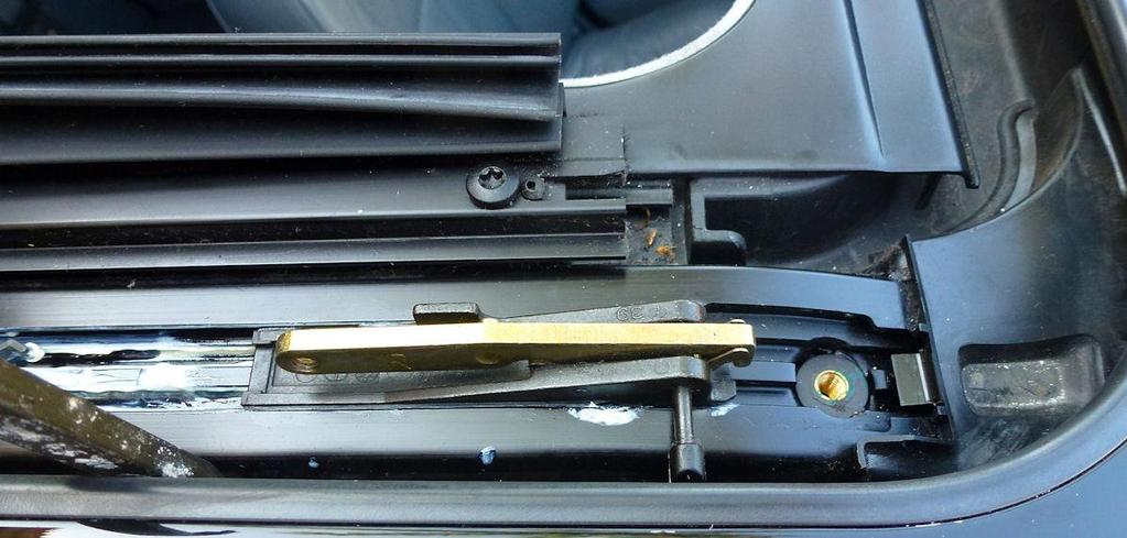 Step 14: Reinstall the tilt hinge sliders into the rails on both sides, then electronically slide the sunroof back about 8 inches. Figure 29.