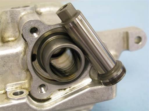 Remove intake piston from intake cylinder. Press piston from vanos inboard side to remove piston from vanos outboard side (1/4 socket extension).