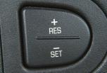 while cruising. SET (Set): Press the bottom of this button to set cruising speed or to decrease vehicle speed while cruising.